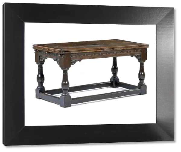Table. Draw-leaf table made from oak with carved friezes, made in England c.1600-1650