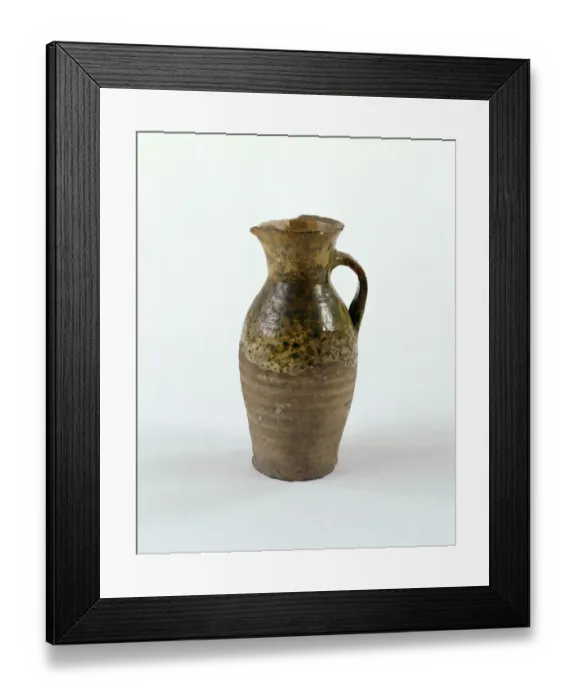 Framed Print : Jug. Earthenware jug with green glaze decoration, a handle Framed Print : Jug. Earthenware jug with green glaze decoration, a handle