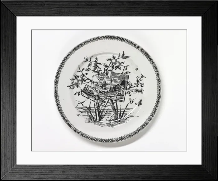 Framed Print : Plate. One of three earthenware plates with a black Framed Print : Plate. One of three earthenware plates with a black