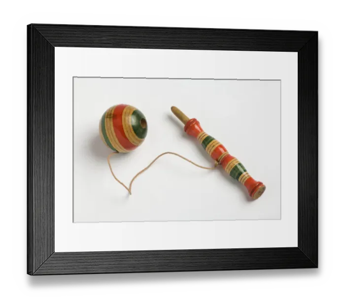 Framed Print : Toy. Wooden toy with a turned boxwood handle and a wooden ball attached with string Framed Print : Toy. Wooden toy with a turned boxwood handle and a wooden ball attached with string