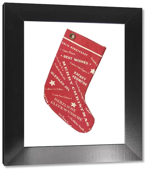Stocking. Red fabric Christmas stocking, printed on each side with a pattern of stars
