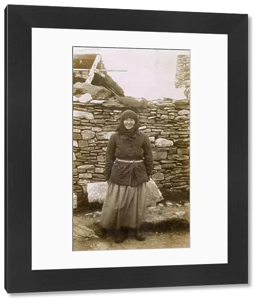 A Local Woman of the Orkney Islands outside her house