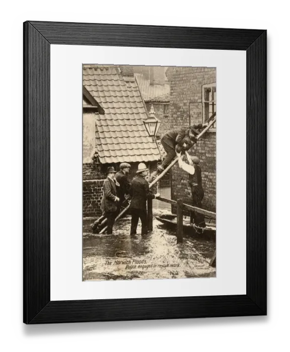 Framed Print : Police rescue a small boy during the Floods in Norwich Framed Print : Police rescue a small boy during the Floods in Norwich