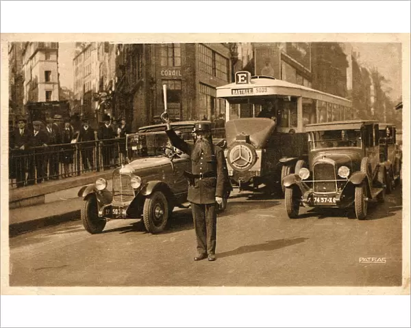 Parisian Officer directing traffic on Les Grand Boulevards
