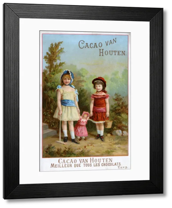 Framed Print : Two children playing in their garden with their dolly Framed Print : Two children playing in their garden with their dolly