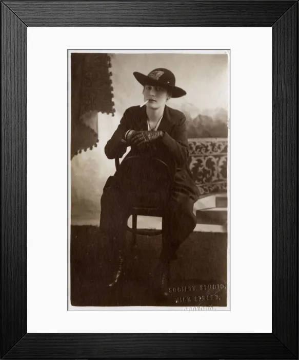 Framed Print : Very Stylish Young Woman stitting backward on a chair Framed Print : Very Stylish Young Woman stitting backward on a chair