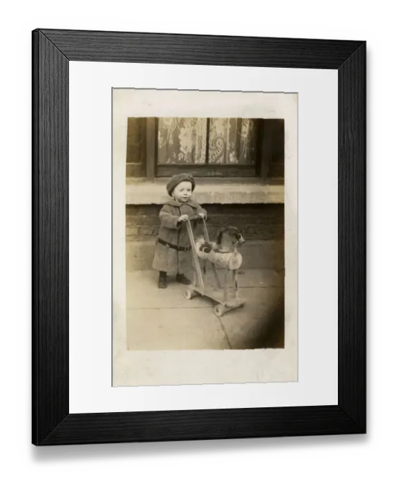 Framed Print : Little Georgie Reach pushing his Toy Horse - Blackpool Framed Print : Little Georgie Reach pushing his Toy Horse - Blackpool