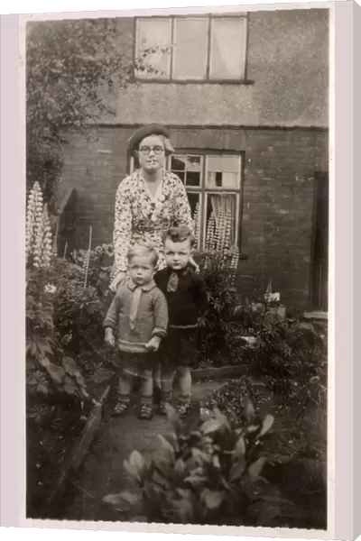 Mother and her two boys in the garden
