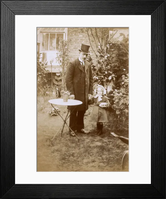 Framed Print : Smart Gentleman and young daughter in garden Framed Print : Smart Gentleman and young daughter in garden