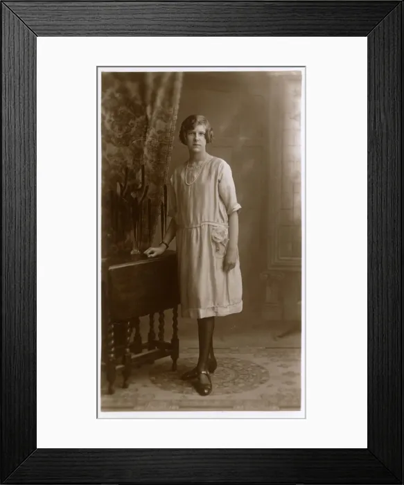 Framed Print : Studio Portrait of a woman in elegant shift dress Framed Print : Studio Portrait of a woman in elegant shift dress