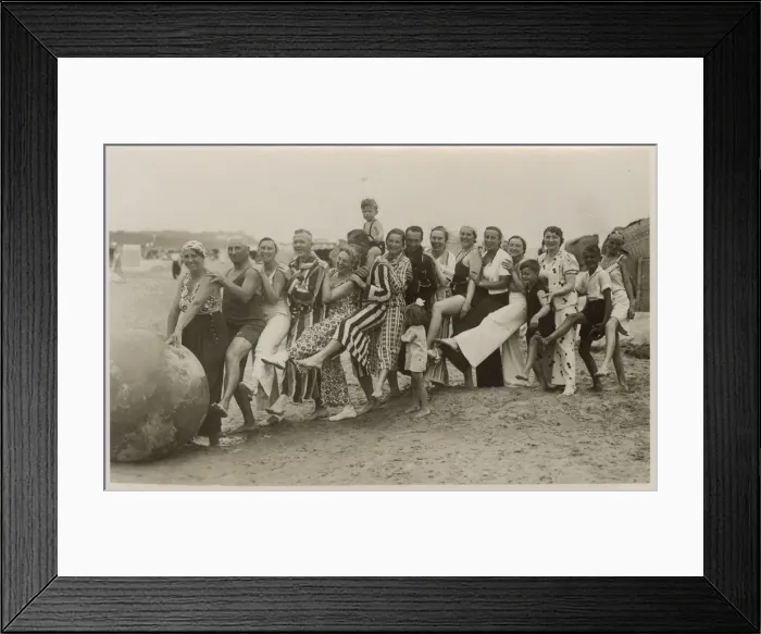 Framed Print : A very jolly group playing with a huge ball on the beach Framed Print : A very jolly group playing with a huge ball on the beach
