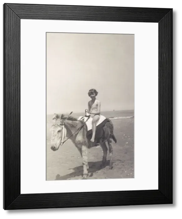 Framed Print : Child riding a seaside donkey Framed Print : Child riding a seaside donkey