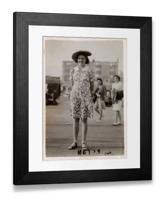 Framed Print : Young lady at the seaside - breezy day - floral print dress Framed Print : Young lady at the seaside - breezy day - floral print dress