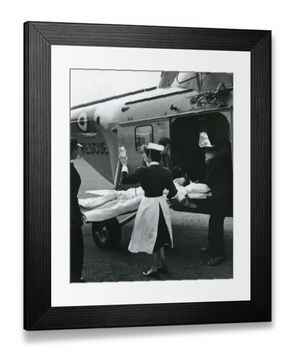 Framed Print : Injured boy loaded into a Westland Whirlwind Framed Print : Injured boy loaded into a Westland Whirlwind