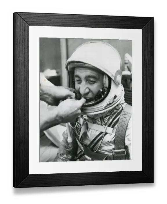 Framed Print : A technician adjusts the microphones for astronaut Virg? Framed Print : A technician adjusts the microphones for astronaut Virg?
