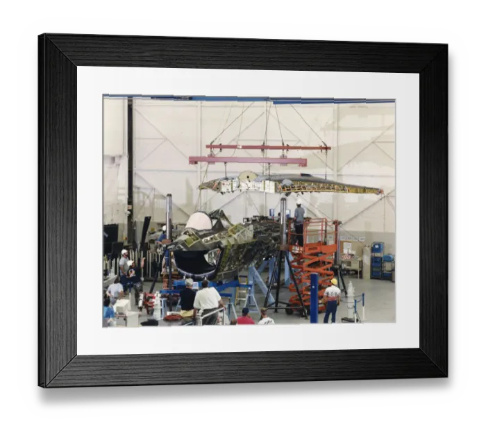 Framed Print : The one-piece wing is lowered into place on the Boing X? Framed Print : The one-piece wing is lowered into place on the Boing X?