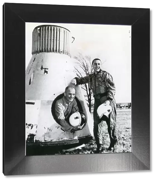 John Glenn and Virgil Grissom pose beside Mercury spacecraft
