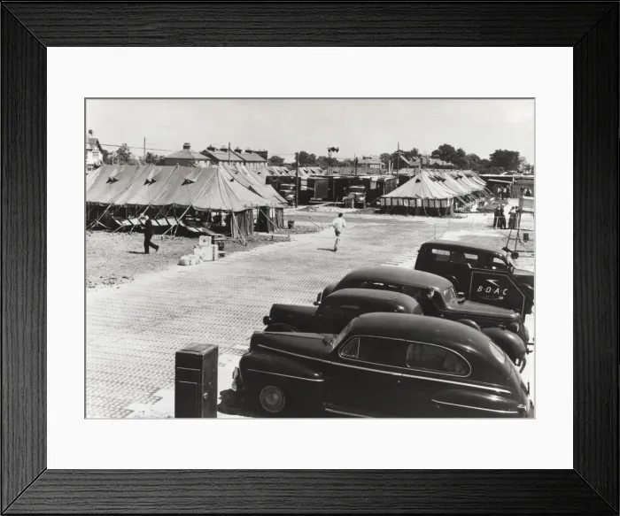 Framed Print : Cars Parked and Tents Used As Terminal Buildings with a ? Framed Print : Cars Parked and Tents Used As Terminal Buildings with a ?