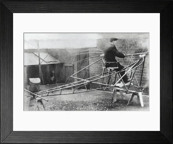Framed Print : Mr a H Watts Sitting on the Bare Structure of His Man-Po? Framed Print : Mr a H Watts Sitting on the Bare Structure of His Man-Po?