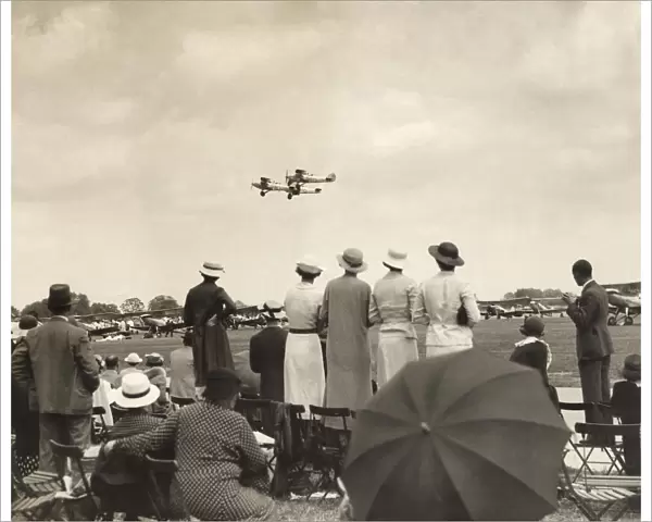 A Crowd Watching a Formation of Royal Airforce Hawker Ha?