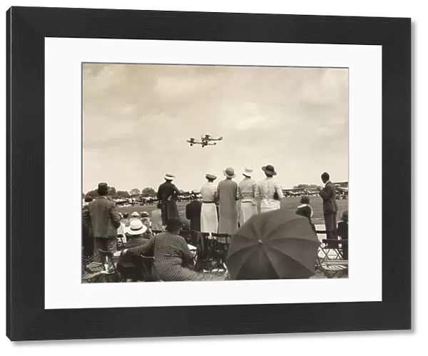 A Crowd Watching a Formation of Royal Airforce Hawker Ha?