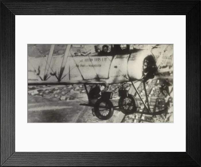 Framed Print : Avro 504K. An Avro 504K Flying over a Town During a National Aviation Day Flypast Date Framed Print : Avro 504K. An Avro 504K Flying over a Town During a National Aviation Day Flypast Date