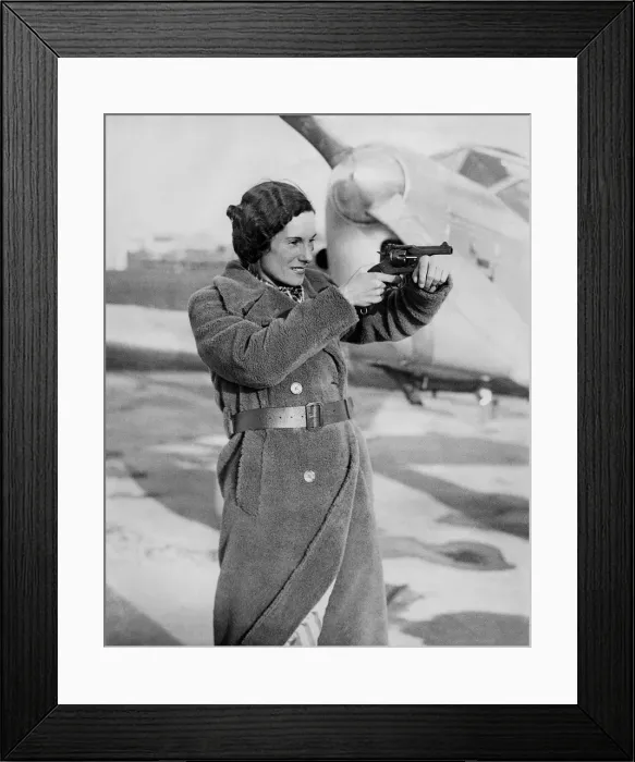Framed Print : A Picture of Jean Batten with a Hand-Gun Framed Print : A Picture of Jean Batten with a Hand-Gun