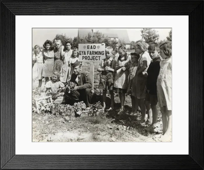 Framed Print : A Corporal with German Children Growing Vegetables at th? Framed Print : A Corporal with German Children Growing Vegetables at th?