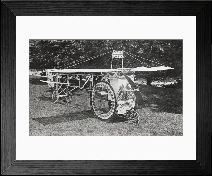 Framed Print : A Model of an Airplane with Flag in a Whitsuntide Procession Framed Print : A Model of an Airplane with Flag in a Whitsuntide Procession