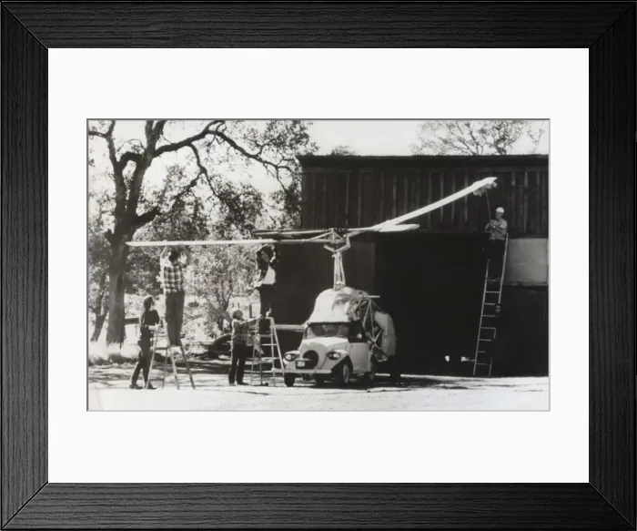 Framed Print : Men Standing on Ladders Attaching the Rotors Onto a Heli? Framed Print : Men Standing on Ladders Attaching the Rotors Onto a Heli?