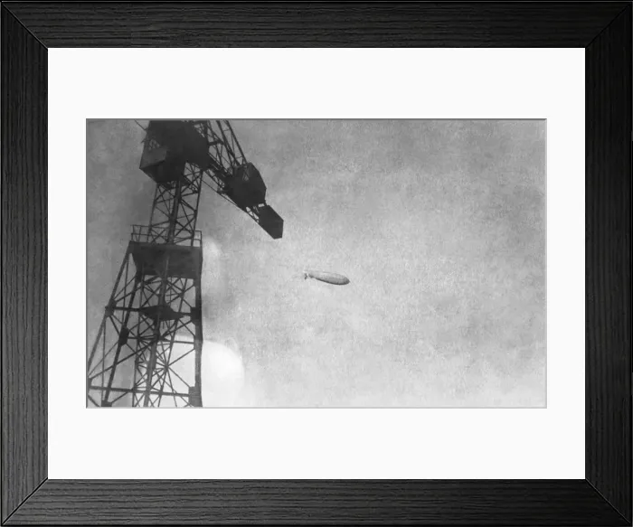 Framed Print : Airship Flying Past a Crane Framed Print : Airship Flying Past a Crane