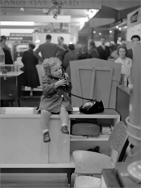Little Girl on the phone at a Trade Show