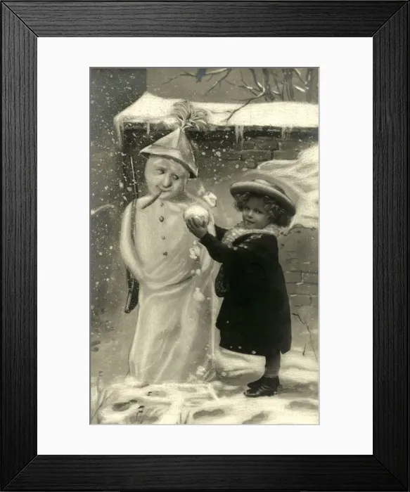 Framed Print : Little Girl with unusual snowman with newspaper hat and gun Framed Print : Little Girl with unusual snowman with newspaper hat and gun