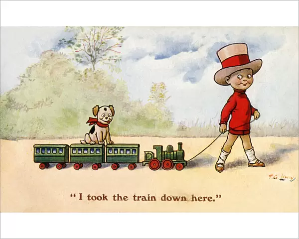 Young boy pulls along his toy train - puppy takes a ride too
