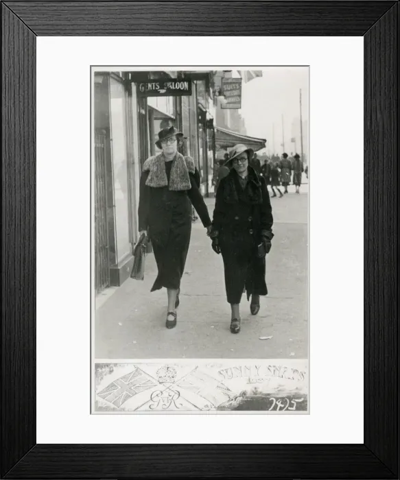 Framed Print : Two stern-faced sisters captured by a candid photographer Framed Print : Two stern-faced sisters captured by a candid photographer