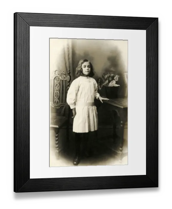 Framed Print : Studio photographic portrait of a young girl in white dress Framed Print : Studio photographic portrait of a young girl in white dress