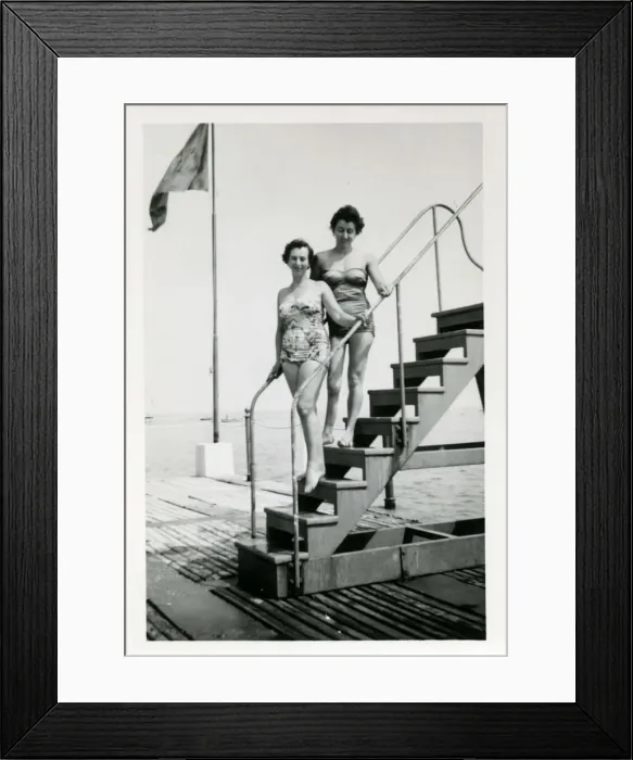 Framed Print : 1950s Bathing Lovelies posing on a set of steps Framed Print : 1950s Bathing Lovelies posing on a set of steps