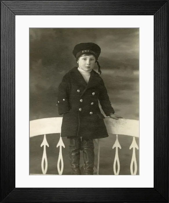 Framed Print : Little Boy in a studio portrait in a HMS Lion sailors cap Framed Print : Little Boy in a studio portrait in a HMS Lion sailors cap