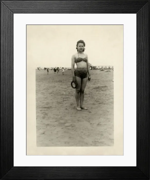 Framed Print : Young woman on the beach in leopardprint two-piece swimsuit Framed Print : Young woman on the beach in leopardprint two-piece swimsuit