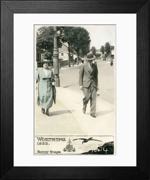 Framed Print : Mother and adult son stroll along a Worthing pavement Framed Print : Mother and adult son stroll along a Worthing pavement