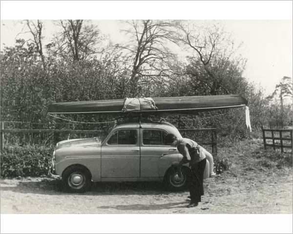 Kayak on the roof of a small 1950s UK car