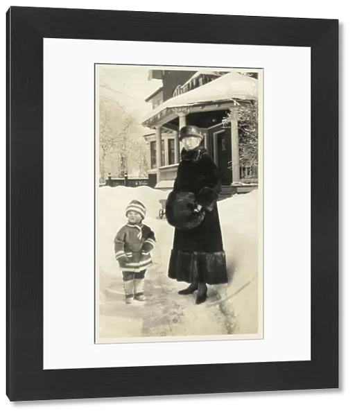 Canada - Grandmother and young grandchild outside her home