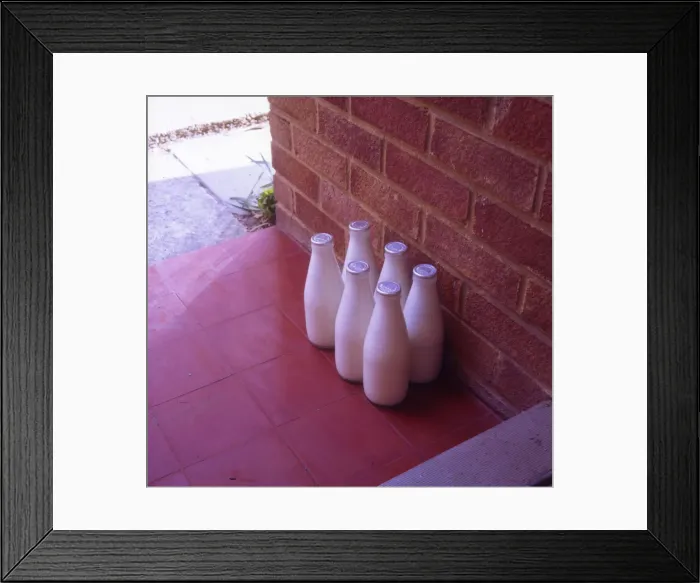 Framed Print : Six bottles of silver-top milk on the doorstep Framed Print : Six bottles of silver-top milk on the doorstep