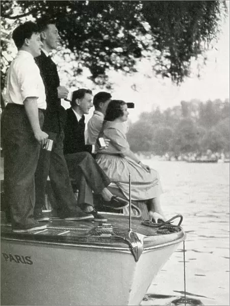Group watching the Henley Regatta from boat, July 1958