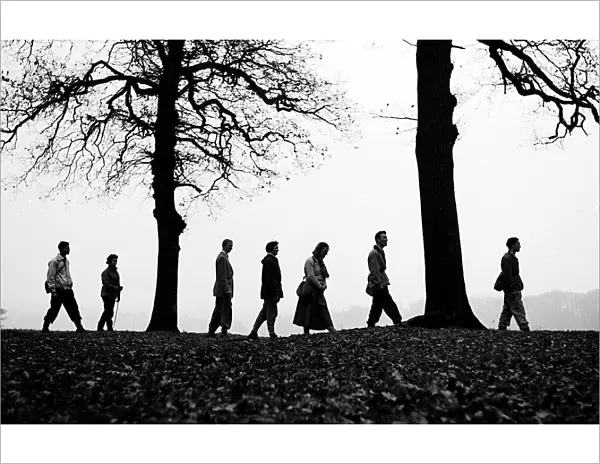 Walkers on the brow of a hill making a silhouette