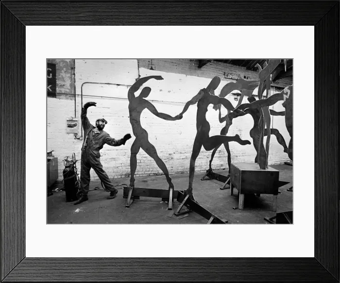 Framed Print : Dancing welder with sculpture Framed Print : Dancing welder with sculpture