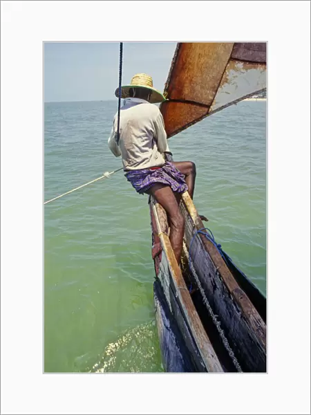 Sri Lankan fisherman in outrigger boat - 3