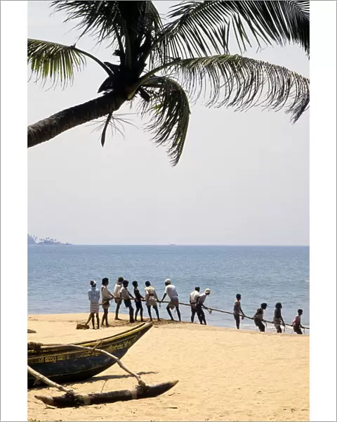 Sri Lankan beach fishermen hauling nets - 1