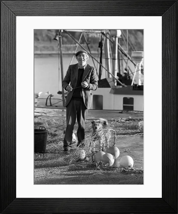 Framed Print : Fisherman on quayside with his dog, Cork, Ireland Framed Print : Fisherman on quayside with his dog, Cork, Ireland