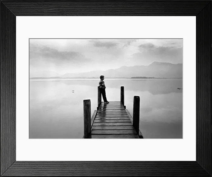Framed Print : A boy looks out across Forggensee, near Fussen, Bavaria Framed Print : A boy looks out across Forggensee, near Fussen, Bavaria